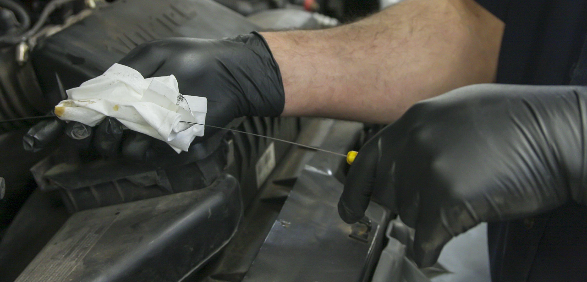 Golco Automotive mechanic performing hands-on vehicle diagnostics