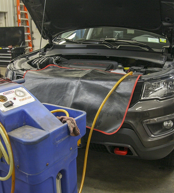 Vehicle fluid flushing service